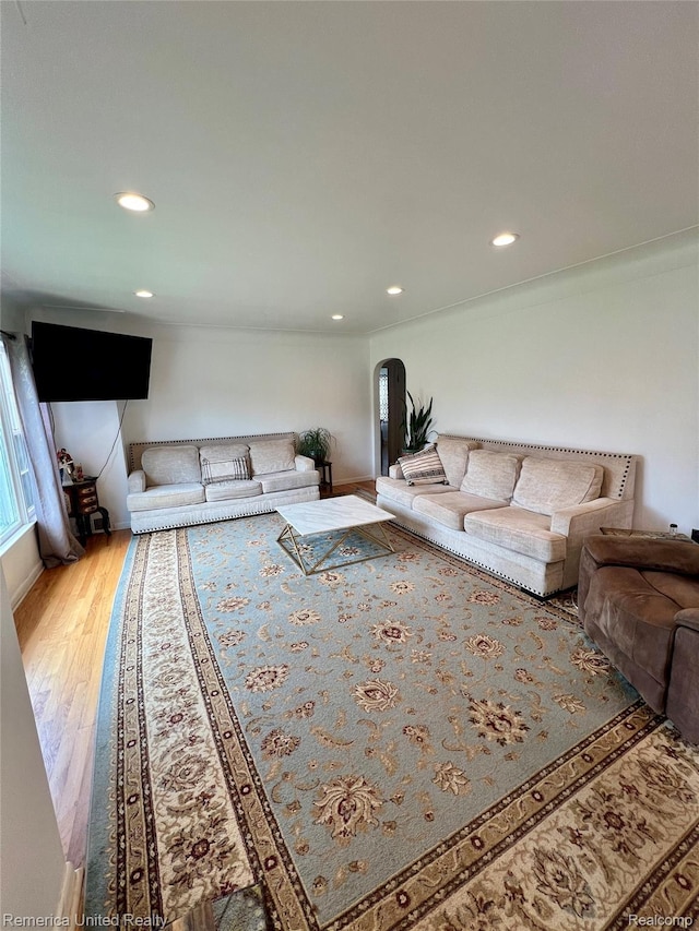 7270 Elizabeth Lake Rd, Waterford, MI 48327 - living room featuring wood finished floors, recessed lighting, and arched walkways