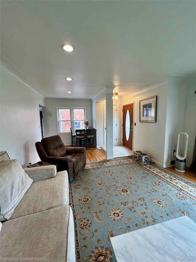 7270 Elizabeth Lake Rd, Waterford, MI 48327 - living area with wood finished floors, decorative columns, and recessed lighting
