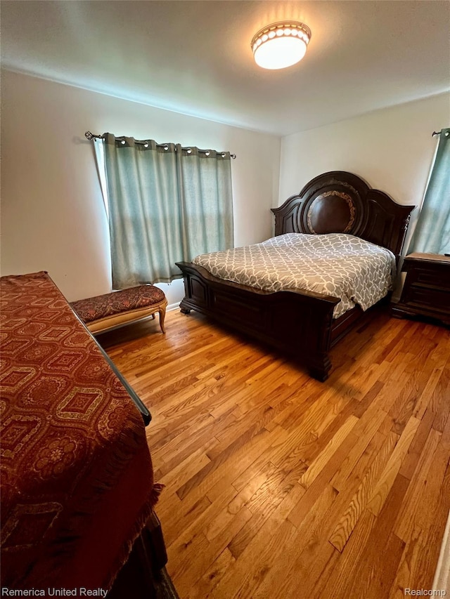 7270 Elizabeth Lake Rd, Waterford, MI 48327 - bedroom featuring light wood-type flooring