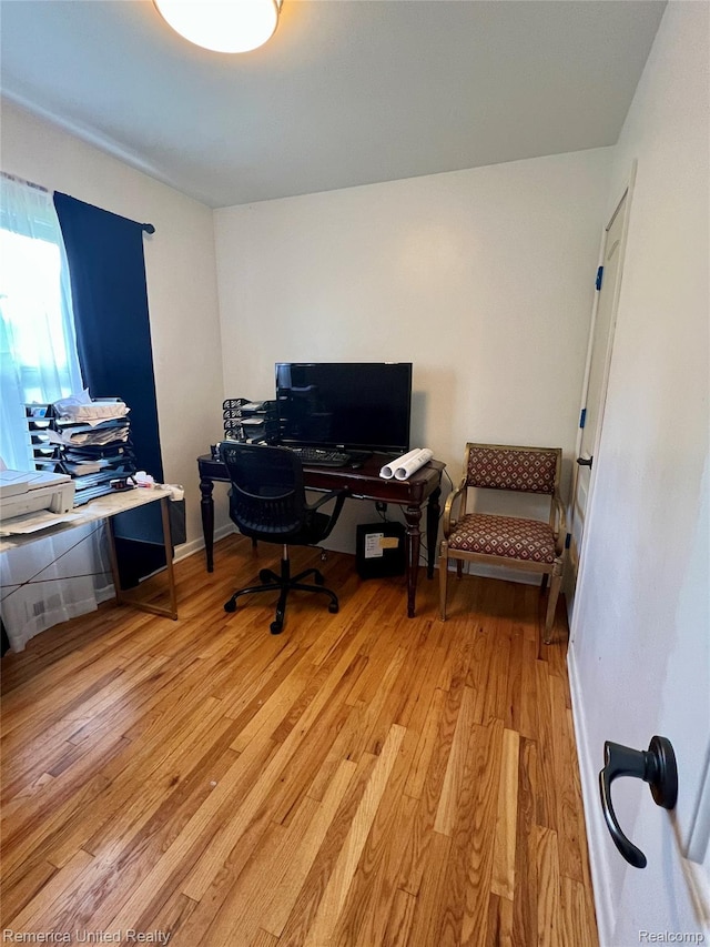 7270 Elizabeth Lake Rd, Waterford, MI 48327 - home office featuring light wood finished floors
