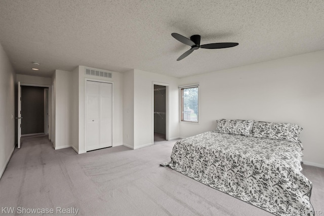 3410 Adams Shore Dr, Waterford, MI 48329 - carpeted bedroom featuring a textured ceiling and ceiling fan