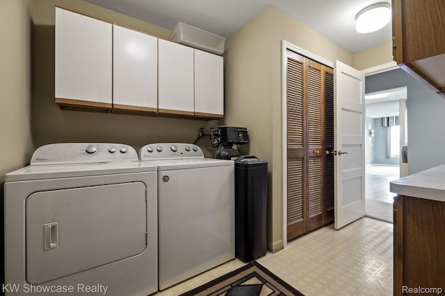 3410 Adams Shore Dr, Waterford, MI 48329 - washroom featuring cabinet space, washer and clothes dryer, and light flooring