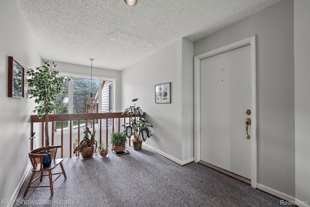 3410 Adams Shore Dr, Waterford, MI 48329 - foyer featuring a textured ceiling and carpet flooring