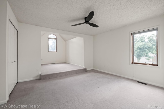 3410 Adams Shore Dr, Waterford, MI 48329 - unfurnished bedroom featuring carpet floors, a textured ceiling, ceiling fan, and a closet