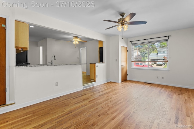 1868 Treadwell St, Westland, MI 48186 - unfurnished living room featuring light wood finished floors and ceiling fan