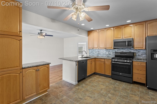 1868 Treadwell St, Westland, MI 48186 - kitchen featuring appliances with stainless steel finishes, a peninsula, ceiling fan, tasteful backsplash, and recessed lighting