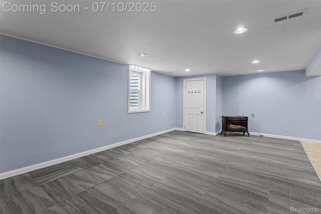 1868 Treadwell St, Westland, MI 48186 - below grade area featuring a wood stove, recessed lighting, and carpet