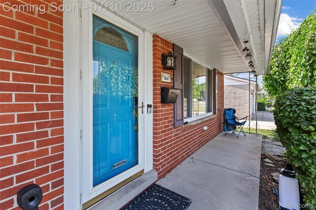 1868 Treadwell St, Westland, MI 48186 - property entrance featuring brick siding and covered porch