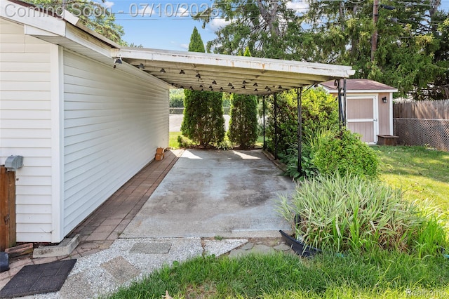1868 Treadwell St, Westland, MI 48186 - view of parking featuring a storage shed and a carport