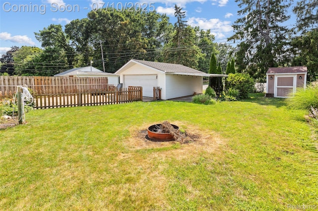 1868 Treadwell St, Westland, MI 48186 - view of yard featuring a fire pit, a garage, and a storage shed