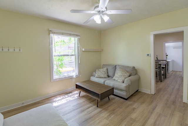 637 Prospect Ave NE, Grand Rapids, MI 49503 - living room with light wood finished floors and a ceiling fan