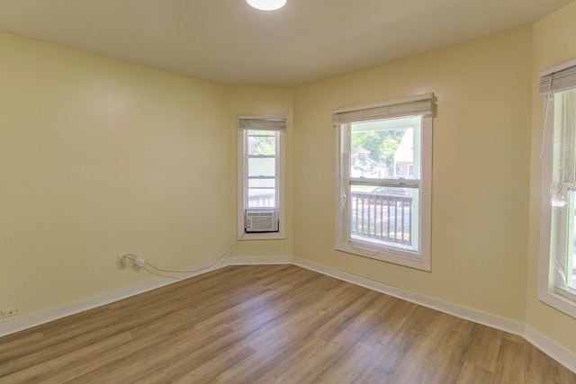 637 Prospect Ave NE, Grand Rapids, MI 49503 - empty room featuring light wood-style floors and cooling unit