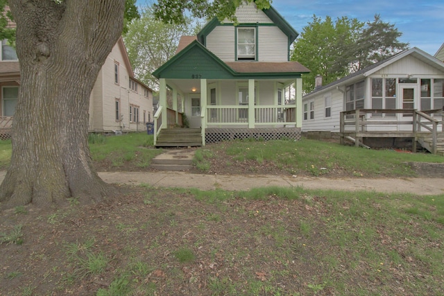 637 Prospect Ave NE, Grand Rapids, MI 49503 - view of front facade with a porch and a sunroom