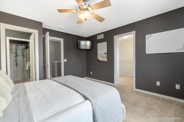 2948 Stoney Creek Ct, Hudsonville, MI 49426 - bedroom featuring a spacious closet, light colored carpet, a closet, and ceiling fan