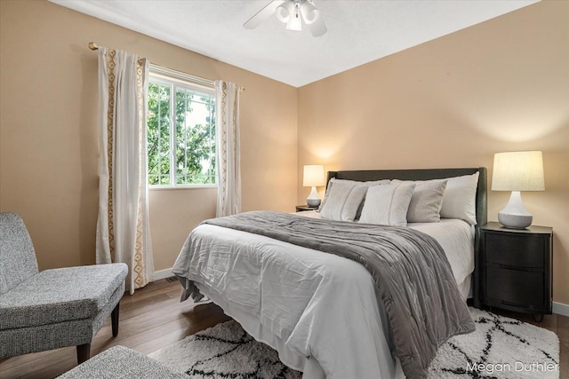 2948 Stoney Creek Ct, Hudsonville, MI 49426 - bedroom featuring wood finished floors and a ceiling fan