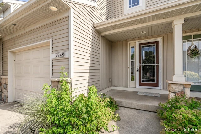 2948 Stoney Creek Ct, Hudsonville, MI 49426 - property entrance with a garage and covered porch
