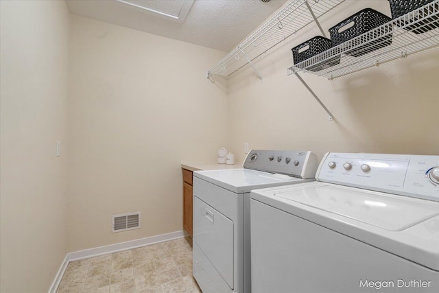 2948 Stoney Creek Ct, Hudsonville, MI 49426 - laundry area featuring washing machine and dryer, cabinet space, and attic access