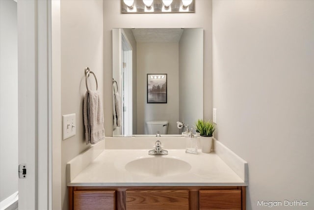 2948 Stoney Creek Ct, Hudsonville, MI 49426 - half bathroom featuring vanity and toilet