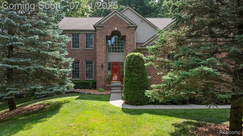 3606 Seney Dr, Lake Orion, MI 48360 - view of front of property with a front yard and brick siding