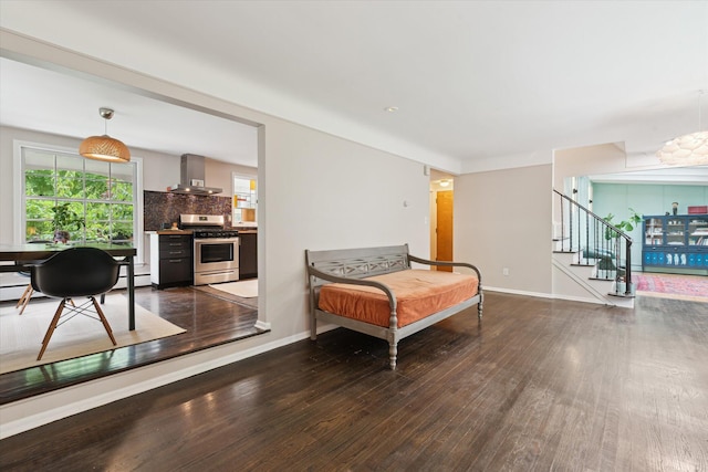2422 Essex, Ann Arbor, MI 48104 - living area featuring wood-type flooring, stairway, a baseboard heating unit, and a chandelier