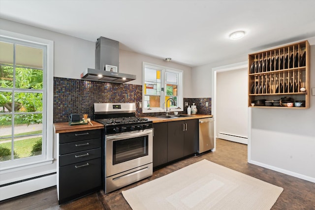 2422 Essex, Ann Arbor, MI 48104 - kitchen with appliances with stainless steel finishes, wall chimney range hood, butcher block countertops, and plenty of natural light