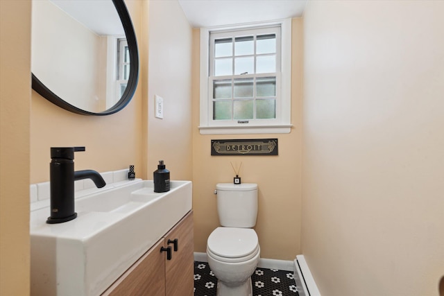 2422 Essex, Ann Arbor, MI 48104 - bathroom featuring baseboard heating and vanity