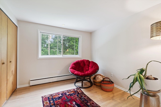 2422 Essex, Ann Arbor, MI 48104 - sitting room with a baseboard radiator and wood finished floors