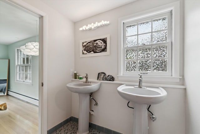 2422 Essex, Ann Arbor, MI 48104 - bathroom with baseboard heating and healthy amount of natural light