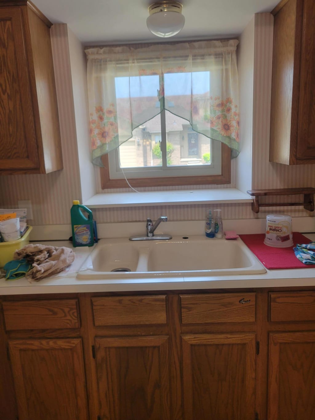 15430 Windmill Dr, Macomb, MI 48044 - kitchen with light countertops and brown cabinetry