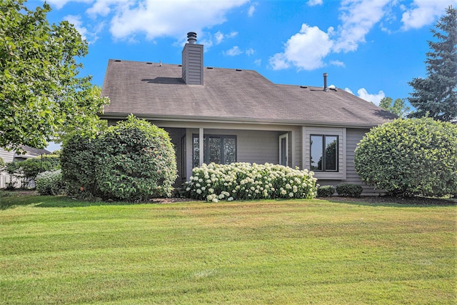1721 Fountainview Ct SE, Caledonia, MI 49316 - rear view of property with a yard, a chimney, and a shingled roof