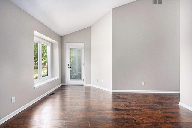 1721 Fountainview Ct SE, Caledonia, MI 49316 - empty room featuring lofted ceiling and dark wood-style floors