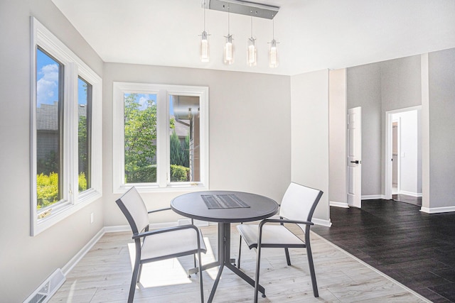 1721 Fountainview Ct SE, Caledonia, MI 49316 - dining space featuring baseboards and wood finished floors