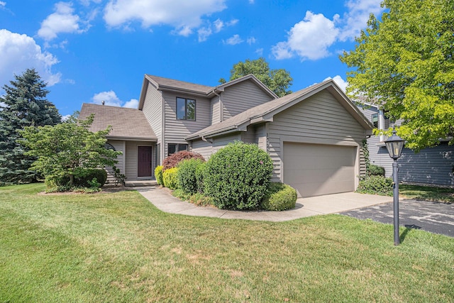 1721 Fountainview Ct SE, Caledonia, MI 49316 - traditional home featuring asphalt driveway, an attached garage, and a front yard