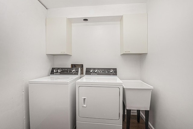 1721 Fountainview Ct SE, Caledonia, MI 49316 - washroom featuring cabinet space, separate washer and dryer, and wood finished floors