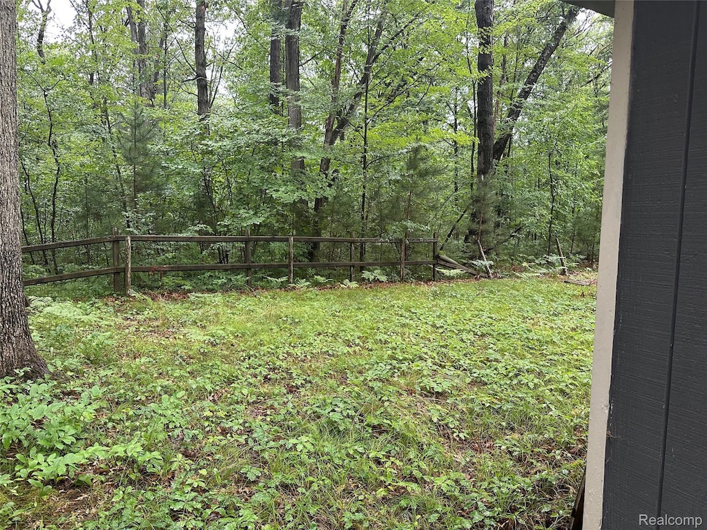 2673 Ivan, Harrison, MI 48625 - view of yard featuring a wooded view