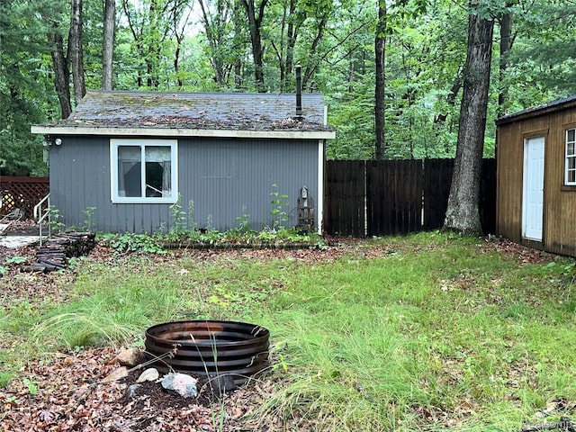 2673 Ivan, Harrison, MI 48625 - view of outbuilding featuring a fire pit