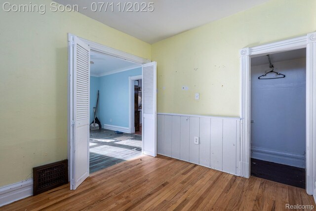 77 Hubbard St, Mount Clemens, MI 48043 - hall with wood finished floors and a wainscoted wall