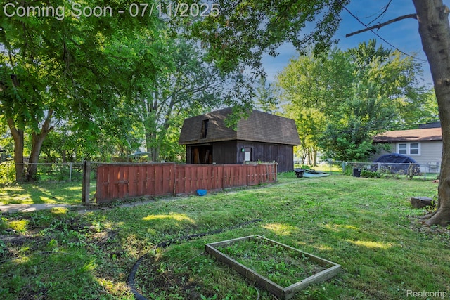 77 Hubbard St, Mount Clemens, MI 48043 - view of yard with a garden and an outbuilding