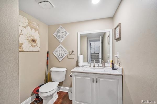 25279 Greenbrooke Dr, Southfield, MI 48033 - bathroom featuring vanity and wood finished floors