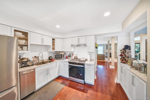 25279 Greenbrooke Dr, Southfield, MI 48033 - kitchen with stainless steel appliances, under cabinet range hood, healthy amount of natural light, white cabinets, and recessed lighting