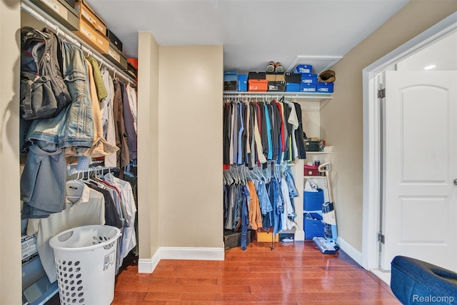 25279 Greenbrooke Dr, Southfield, MI 48033 - walk in closet with wood finished floors