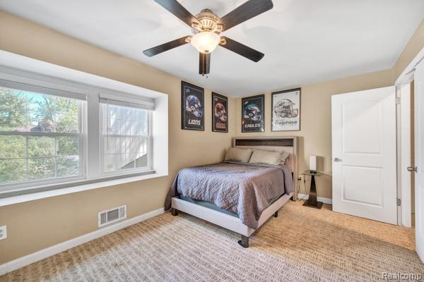 25279 Greenbrooke Dr, Southfield, MI 48033 - carpeted bedroom with baseboards and ceiling fan