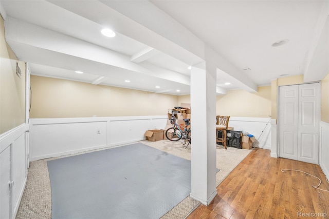 25279 Greenbrooke Dr, Southfield, MI 48033 - finished below grade area featuring a wainscoted wall, wood finished floors, recessed lighting, and a decorative wall