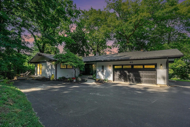 191 S Lake Doster Dr, Plainwell, MI 49080 - view of front of house featuring asphalt driveway and a garage