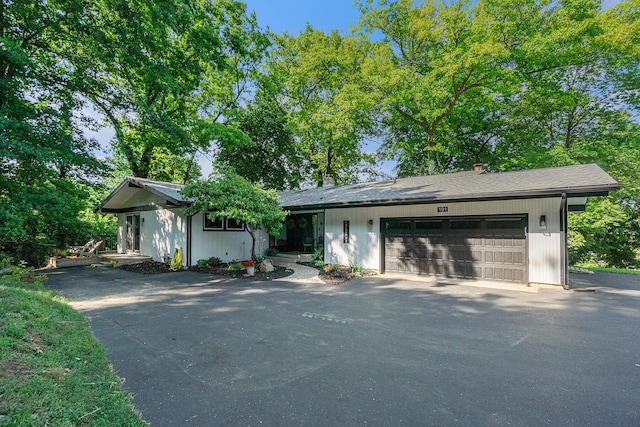 191 S Lake Doster Dr, Plainwell, MI 49080 - ranch-style house featuring driveway and a garage