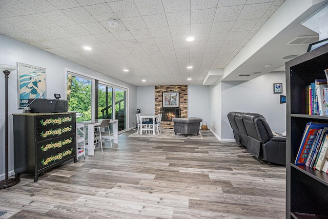 191 S Lake Doster Dr, Plainwell, MI 49080 - office area featuring wood finished floors, a brick fireplace, and recessed lighting