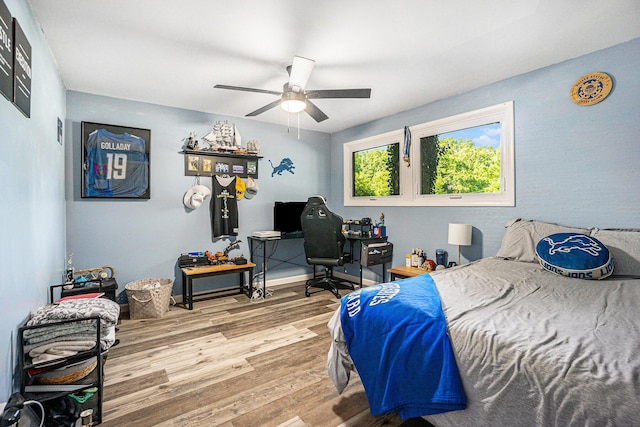 191 S Lake Doster Dr, Plainwell, MI 49080 - bedroom featuring wood finished floors, a ceiling fan, and an office area