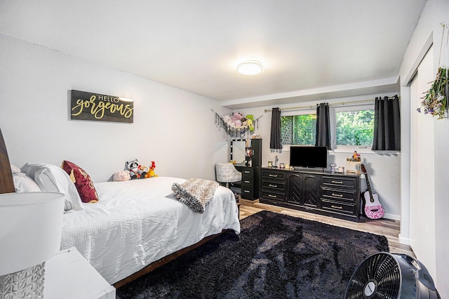 191 S Lake Doster Dr, Plainwell, MI 49080 - bedroom with light wood-style floors and baseboards
