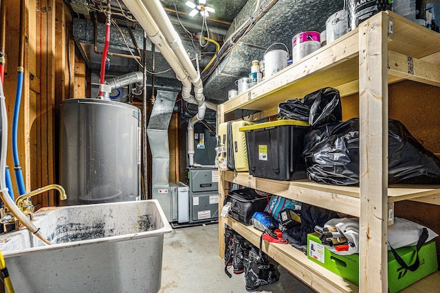 191 S Lake Doster Dr, Plainwell, MI 49080 - storage room featuring water heater and heating unit
