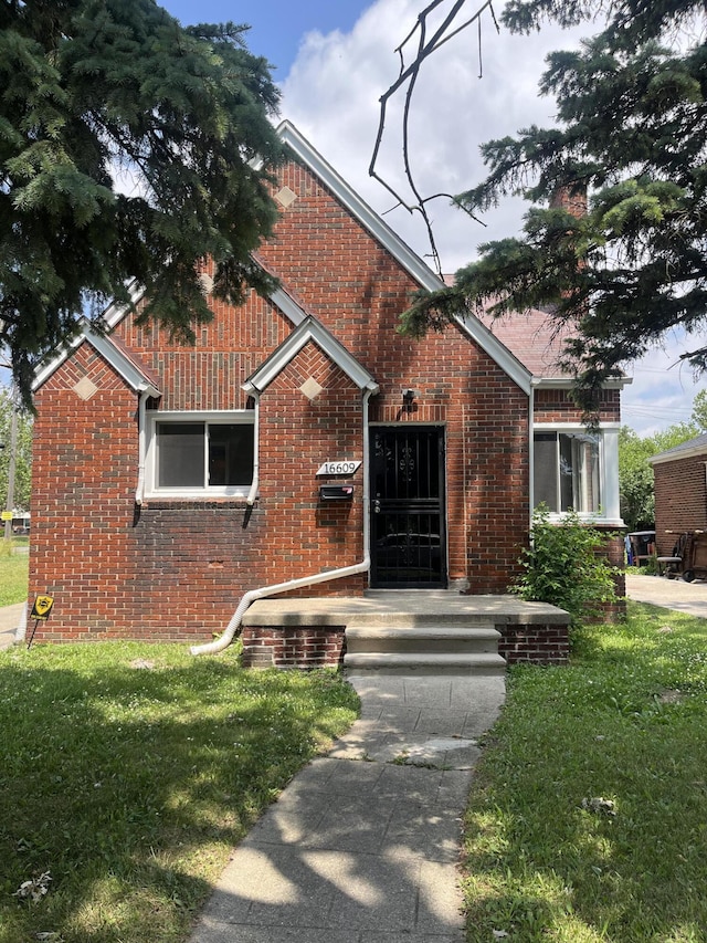 16609 Edmore Dr, Detroit, MI 48205 - view of front of home with brick siding and a front lawn